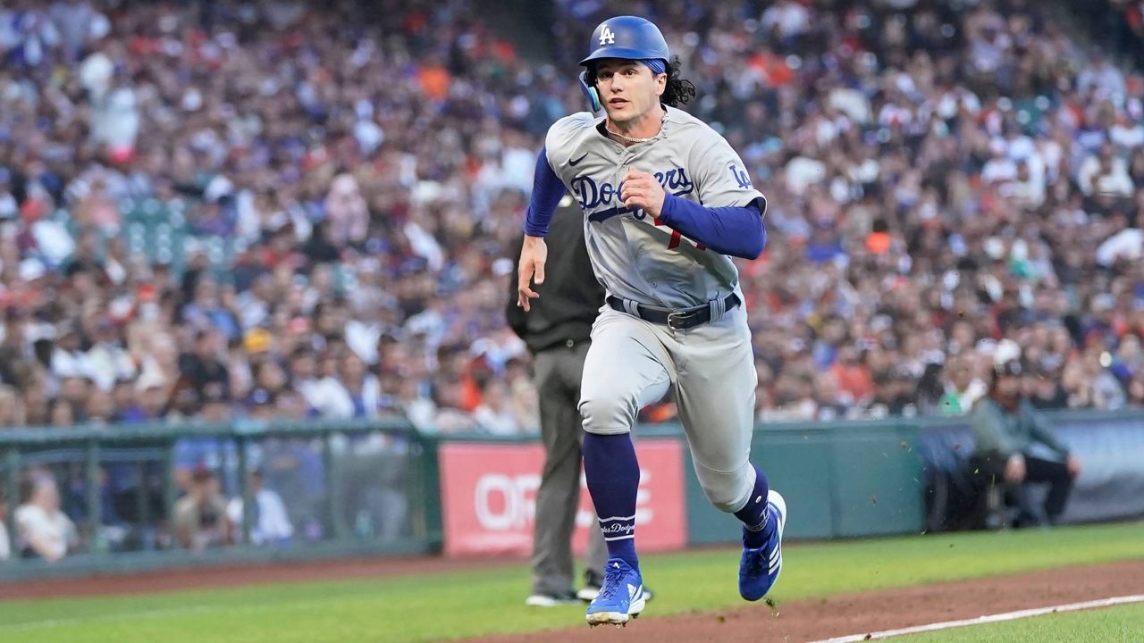 Los Angeles Dodgers' James Outman runs home to score against the Giants during the third inning of a baseball game in San Francisco on Monday. (AP Photo/Jeff Chiu)