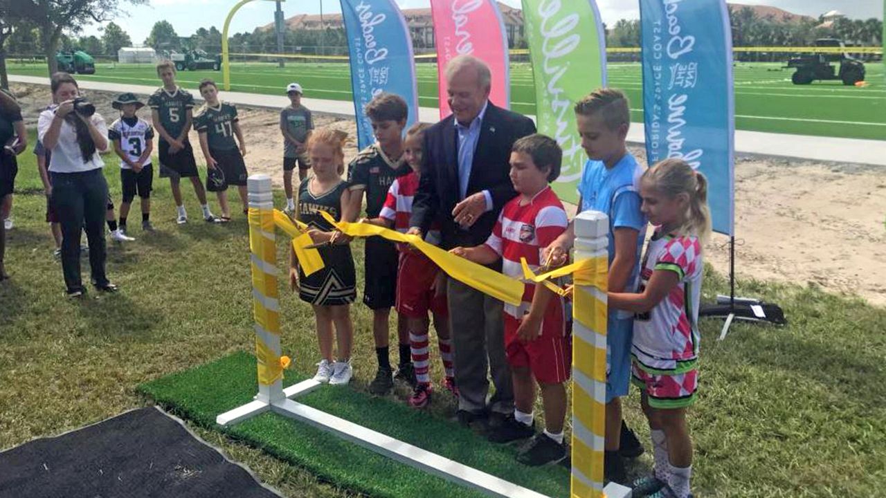 Brevard County leaders cut the ribbon on the $5 million AstroTurf, which will be used on seven new fields at Viera Regional Park. (Greg Pallone, staff)