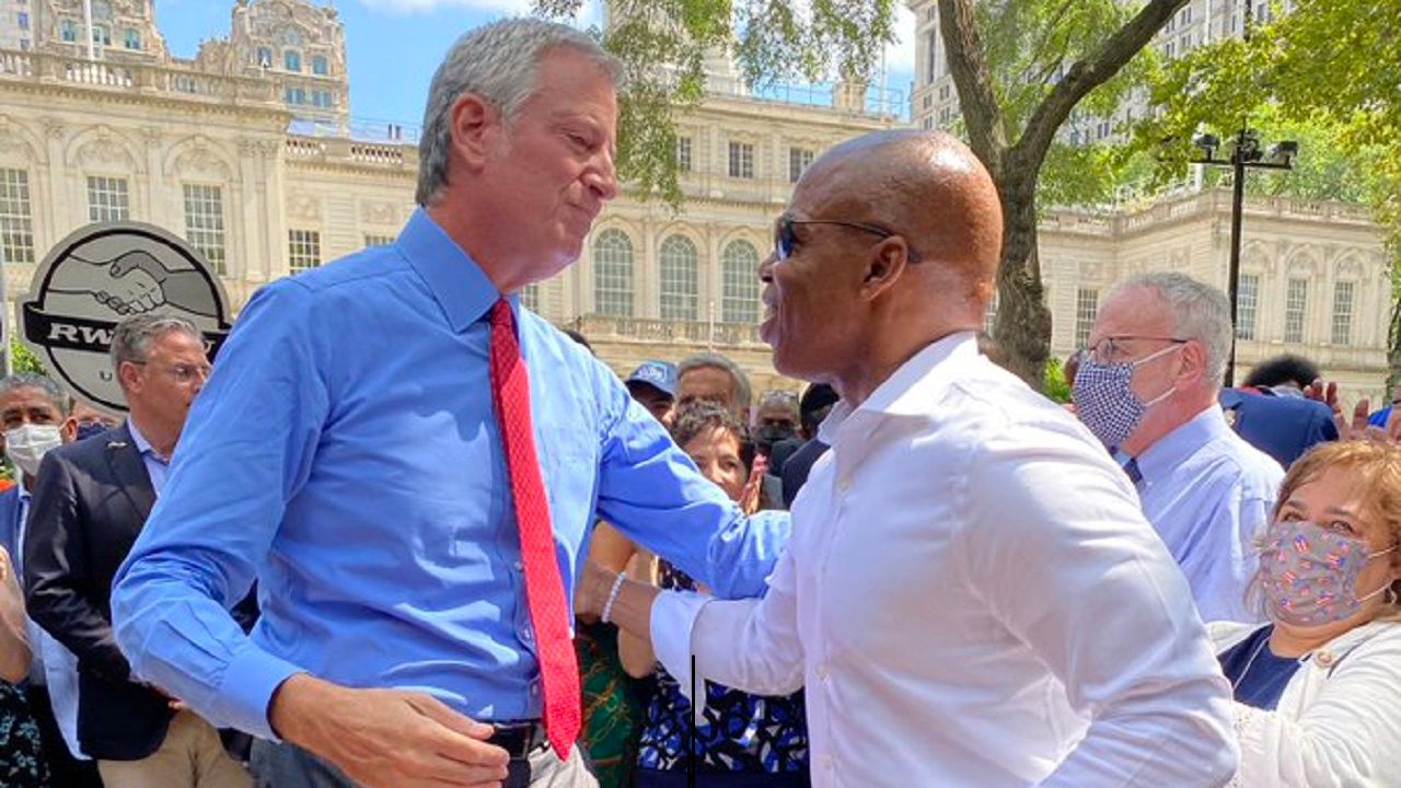 Mayor Bill de Blasio, left, with Democratic mayoral nominee Eric Adams at an event outside City Hall on Aug. 2, 2021 where de Blasio endorsed Adams’s bid for his job