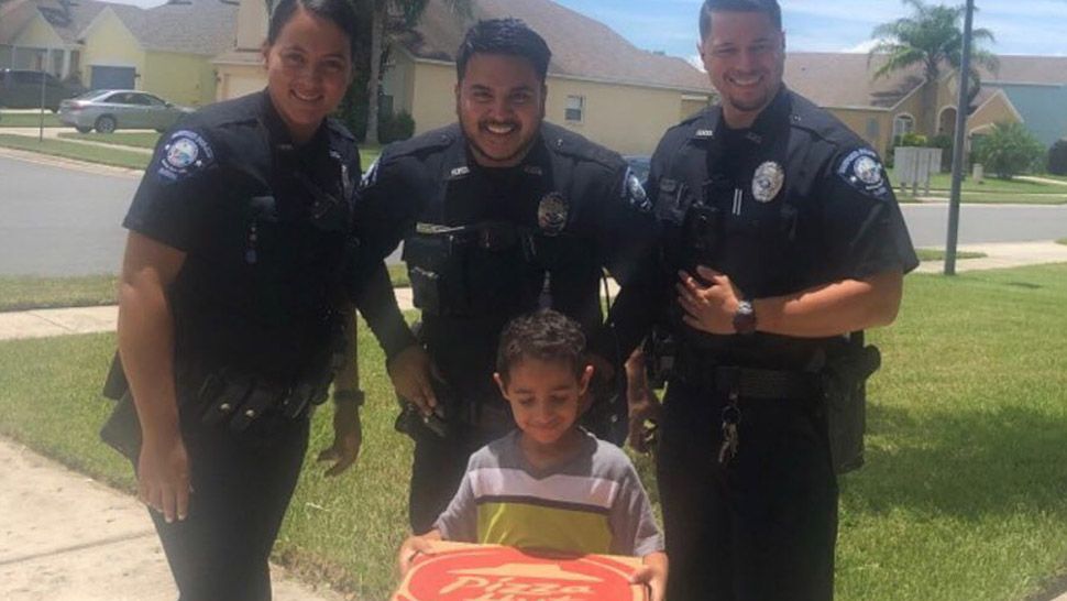 A young boy in Sanford called 911 to order pizza and got a special delivery and lesson from police officers. (Courtesy of Sanford Police Department/Facebook)