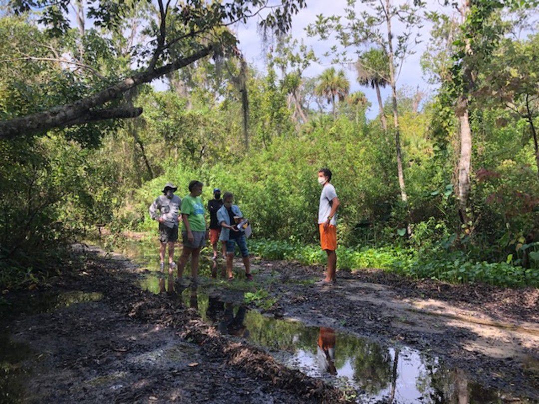 Residents standing in the Little Wekiva River. (Jeanette Schreiber)