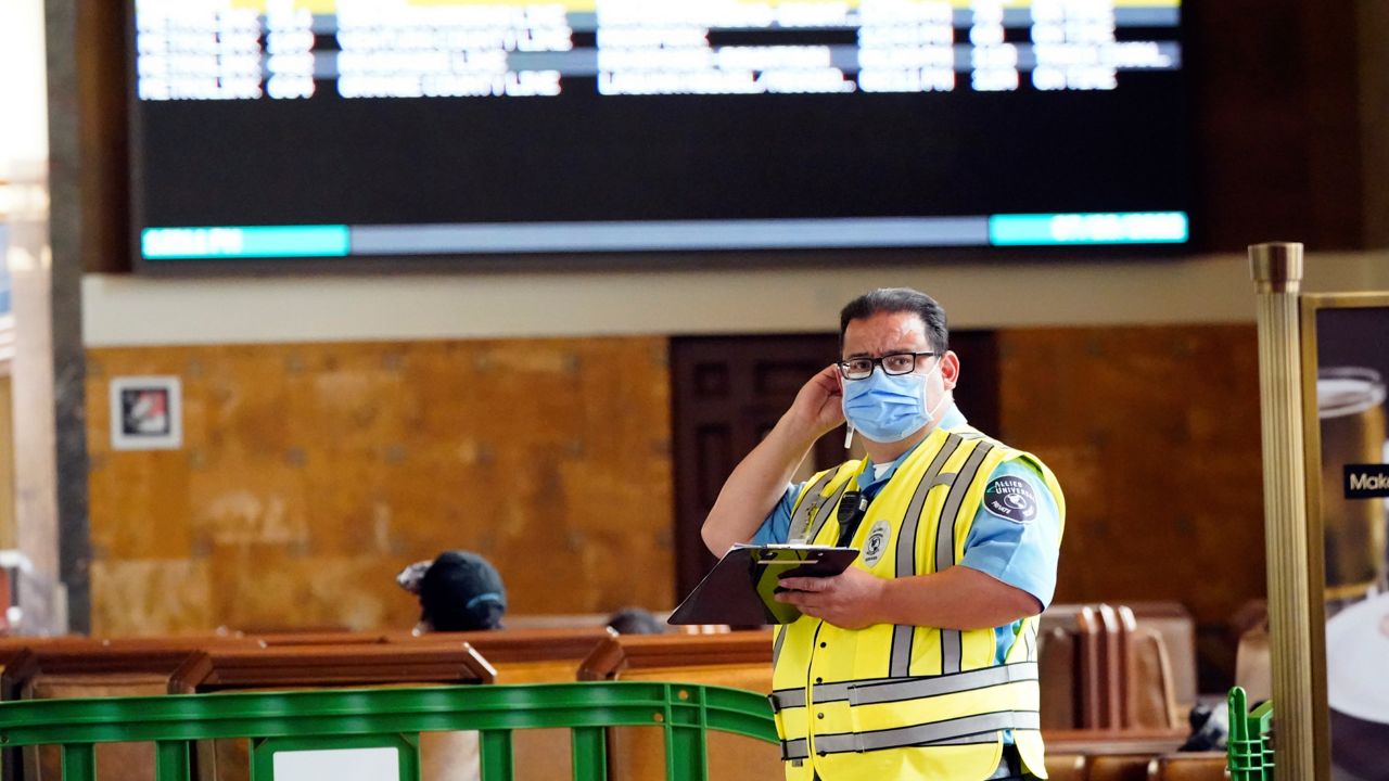 A security guard wears a mask inside Union Station Thursday, July 28, 2022, in Los Angeles. (AP Photo/Marcio Jose Sanchez)