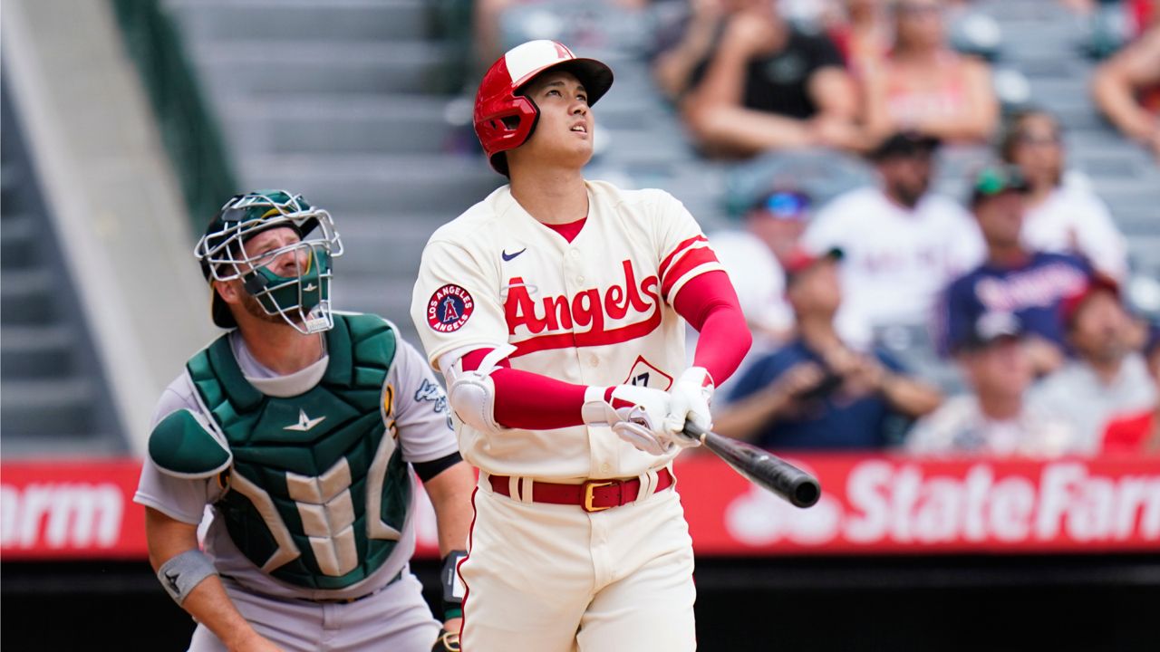 Los Angeles Angels' Shohei Ohtani, of Japan, watches after hitting a home run during the seventh inning of a baseball game against the Oakland Athletics Thursday, Aug. 4, 2022, in Anaheim, Calif. (AP Photo/Jae C. Hong)