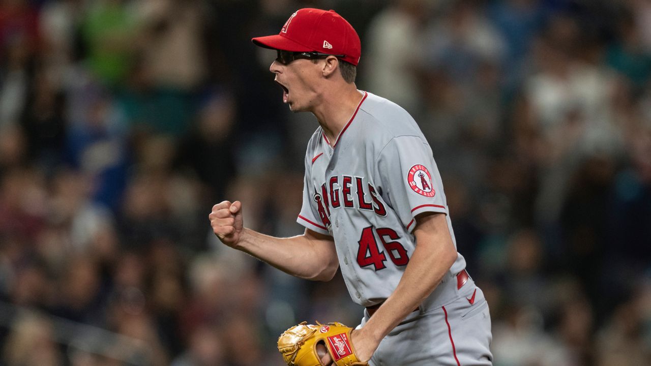 Los Angeles Angels relief pitcher Jimmy Herget celebrates after a baseball game against the Seattle Mariners, Friday, Aug. 5, 2022, in Seattle. (AP Photo/Stephen Brashear)