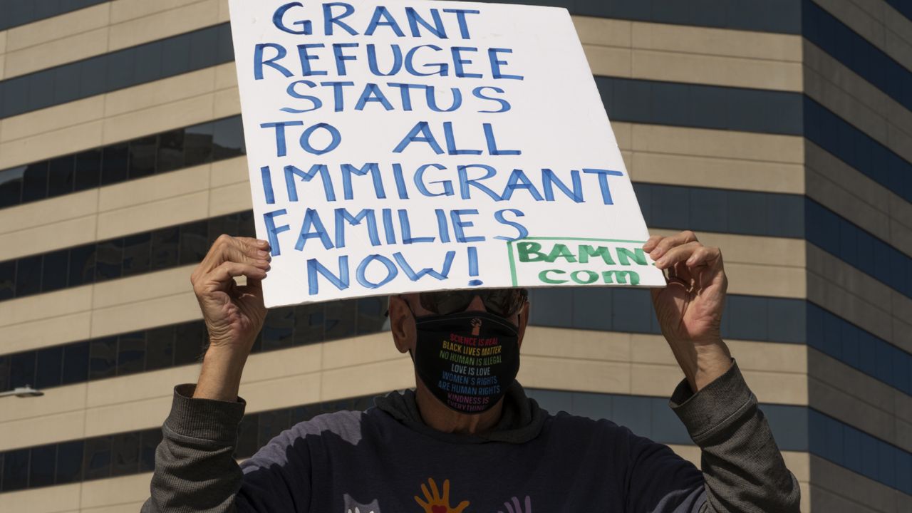 Members of the Coalition to Defend Affirmative Action, Integration and Immigrant Rights, and Fight for Equality By Any Means Necessary, known as By Any Means Necessary (BAMN), hold a rally to demand the freedom of immigrant children in detention at a temporary shelter facility at the Long Beach Convention Center in Long Beach, Calif., Saturday, May 22, 2021. (AP Photo/Damian Dovarganes)