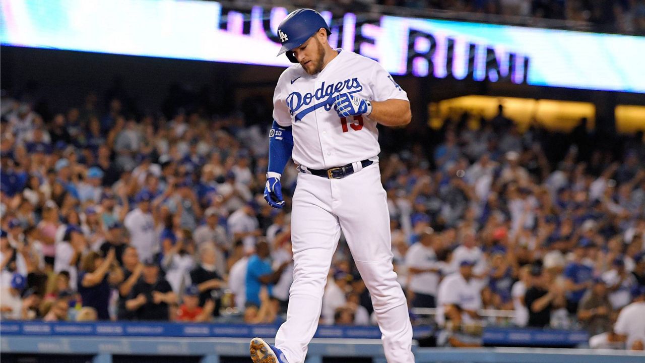 Los Angeles Dodgers' Max Muncy scores after hitting a solo home run during the third inning of a baseball game against the Minnesota Twins Tuesday in LA. (AP Photo/Mark J. Terrill)