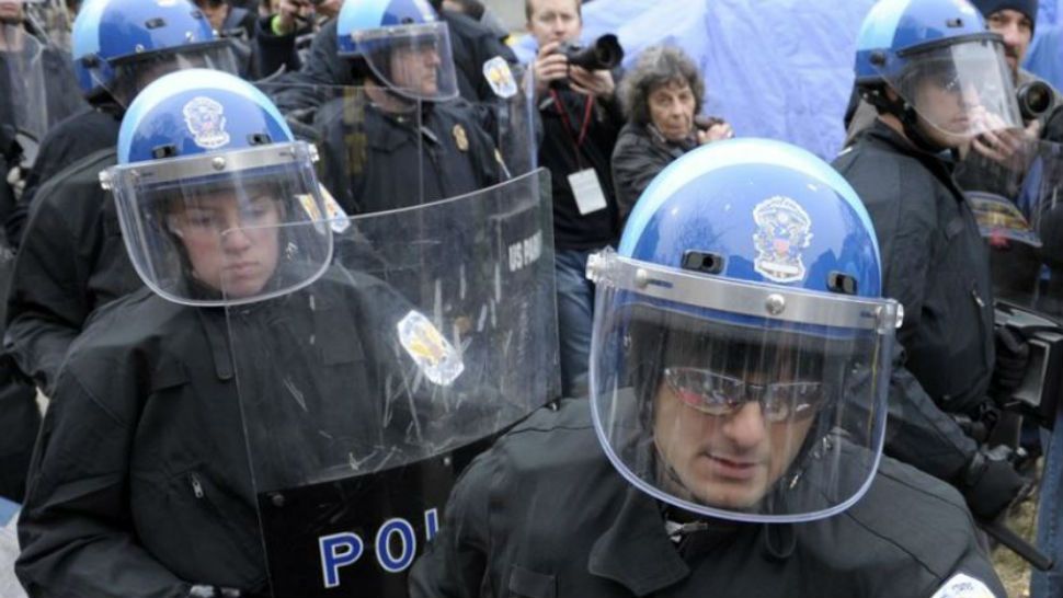 FILE - In this Deb. 4 2012 file photo, U.S. park Police are seen working in riot gear in Washington. 