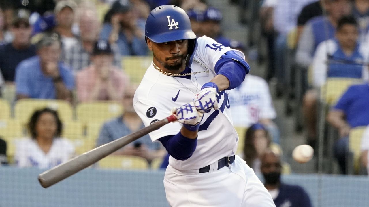 Los Angeles Dodgers' Mookie Betts singles during the first inning of the team's baseball game against the Los Angeles Angels on Friday, Aug. 6, 2021, in Los Angeles. (AP Photo/Marcio Jose Sanchez)