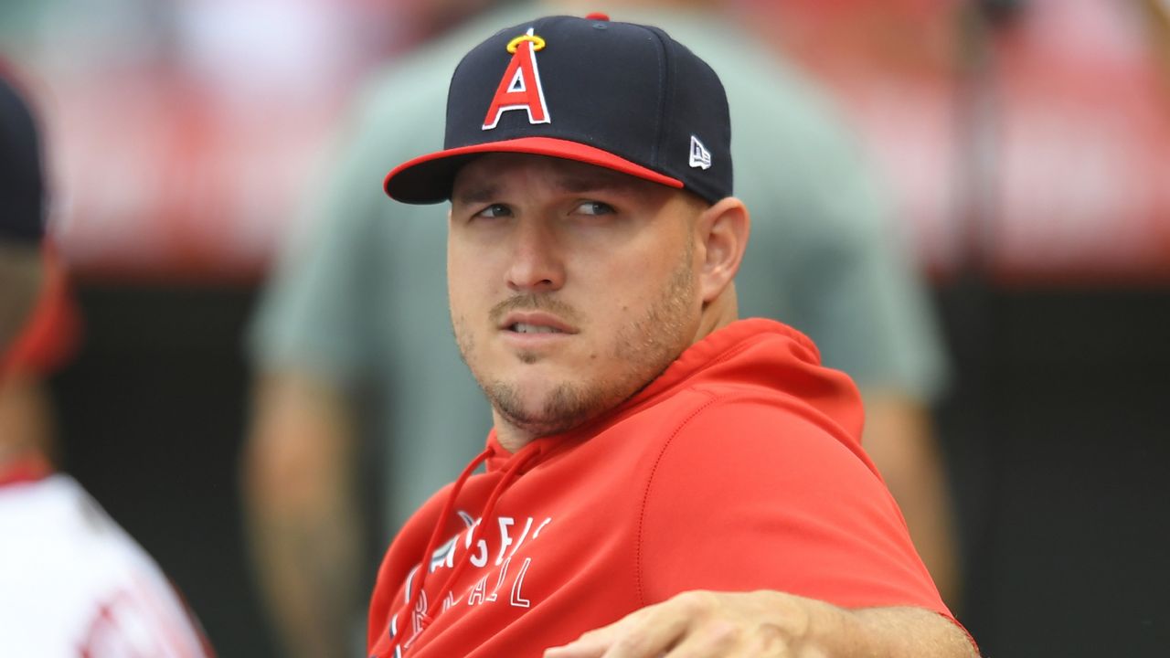 Los Angeles Angels' Mike Trout sits in the dugout during a baseball game against the Oakland Athletics Friday, July 30, 2021, in Anaheim, Calif. (AP Photo/John McCoy)