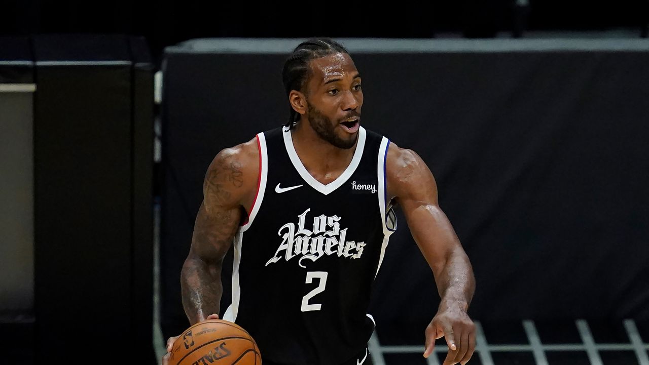 Los Angeles Clippers forward Kawhi Leonard (2) controls the ball during Game 7 of an NBA basketball first-round playoff series against the Dallas Mavericks Sunday, June 6, 2021, in Los Angeles, Calif. (AP Photo/Ashley Landis)