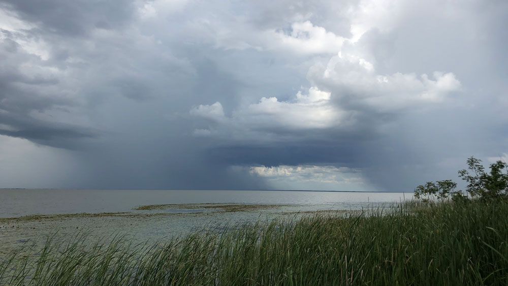 Sent via Spectrum News 13 app: Storm clouds gather over Lake Apopka Monday, Aug. 13. (Karen Lary, Viewer)