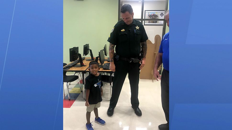 Brevard County Sheriff's Office Corporal Colin Kearns is the tallest guy at Viera Charter School. (Greg Pallone, staff)