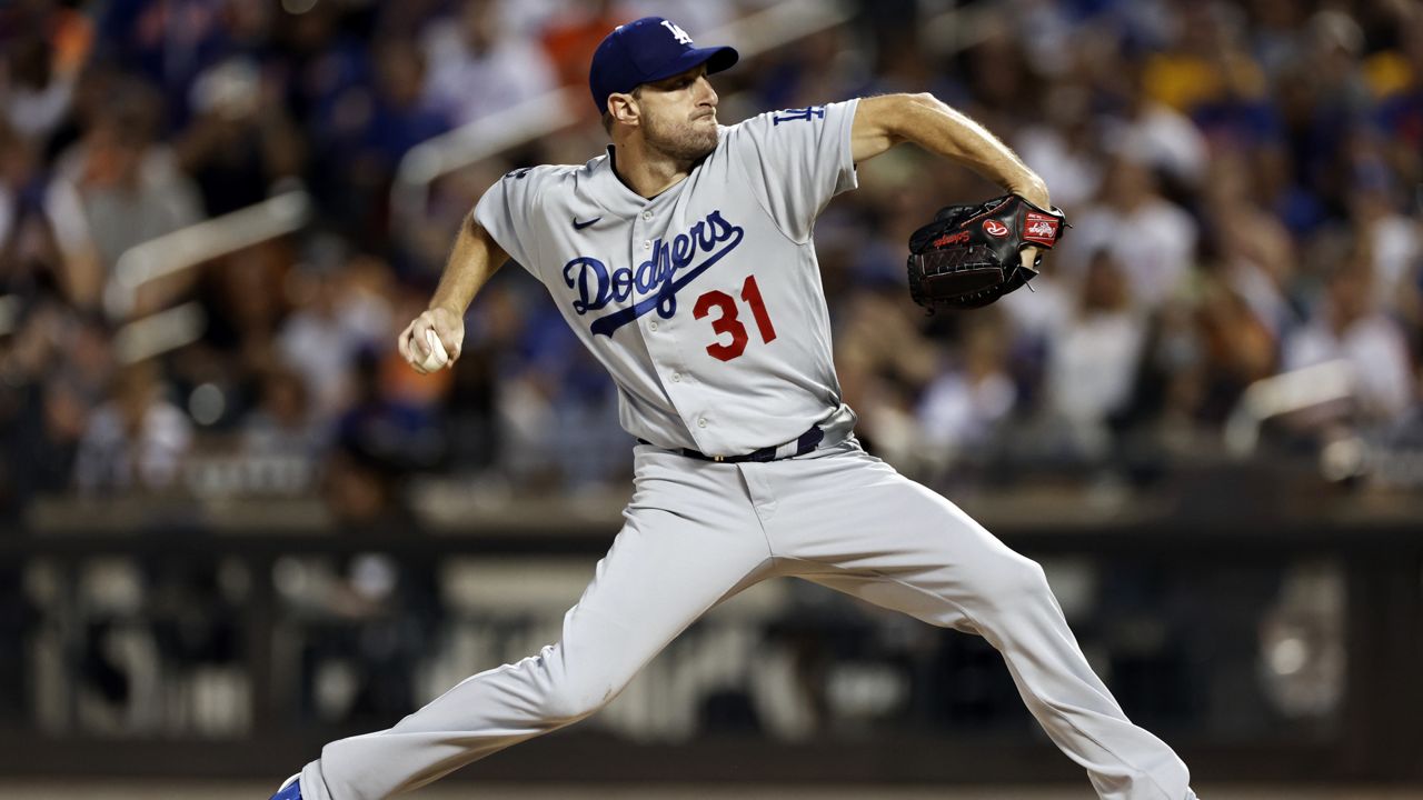 Los Angeles Dodgers pitcher Max Scherzer delivers a pitch during the second inning of a baseball game against the New York Mets on Sunday, Aug. 15, 2021, in New York. (AP Photo/Adam Hunger)