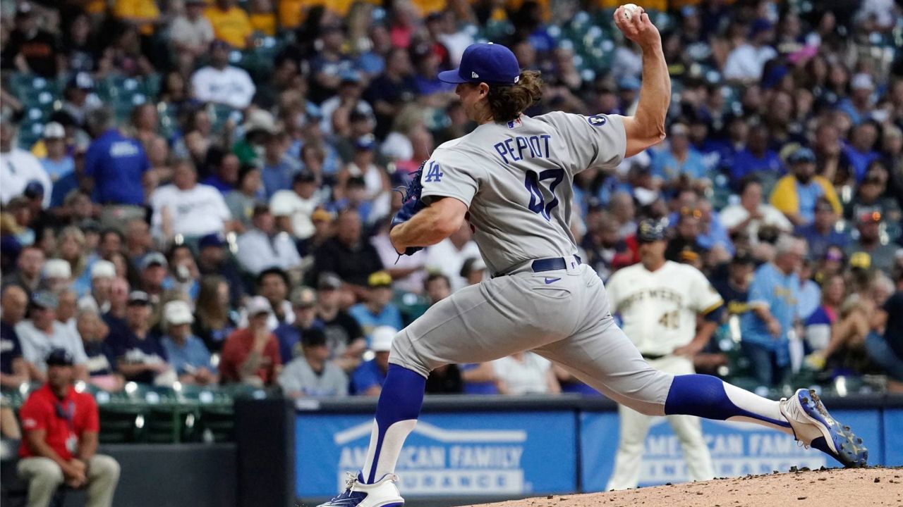 Milwaukee Brewers left fielder Andrew McCutchen catches for an out