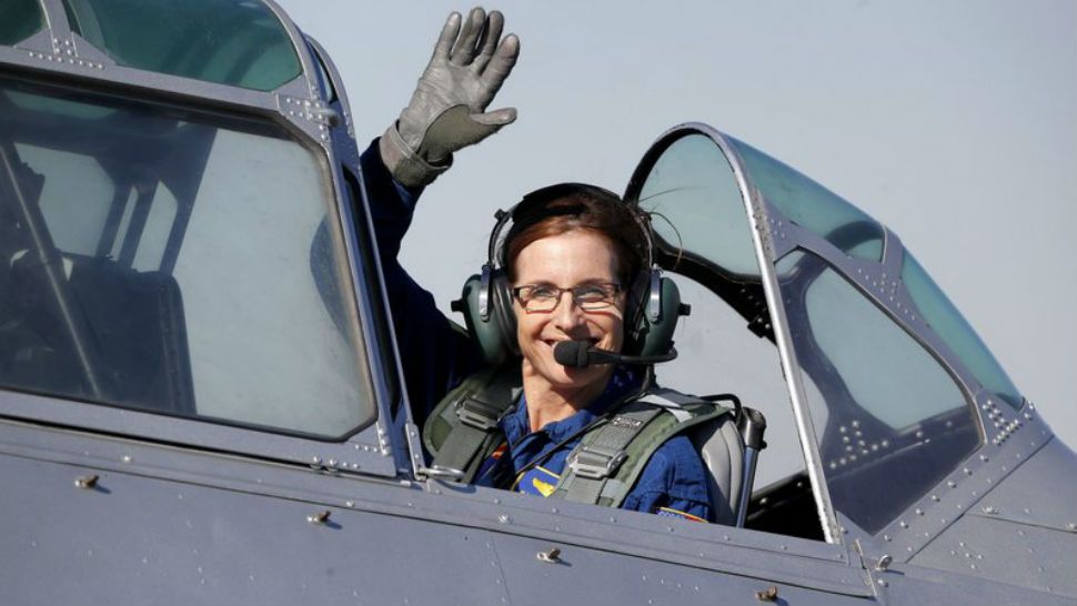 FILE - In this Jan. 12, 2018, file photo, Rep. Martha McSally, R-Ariz., leaves in a T-6 World War II airplane after speaking at a rally in Phoenix. Women with military experience _ many of them combat veterans _ are among the record number of female candidates running for office this year. (AP Photo/Matt York)