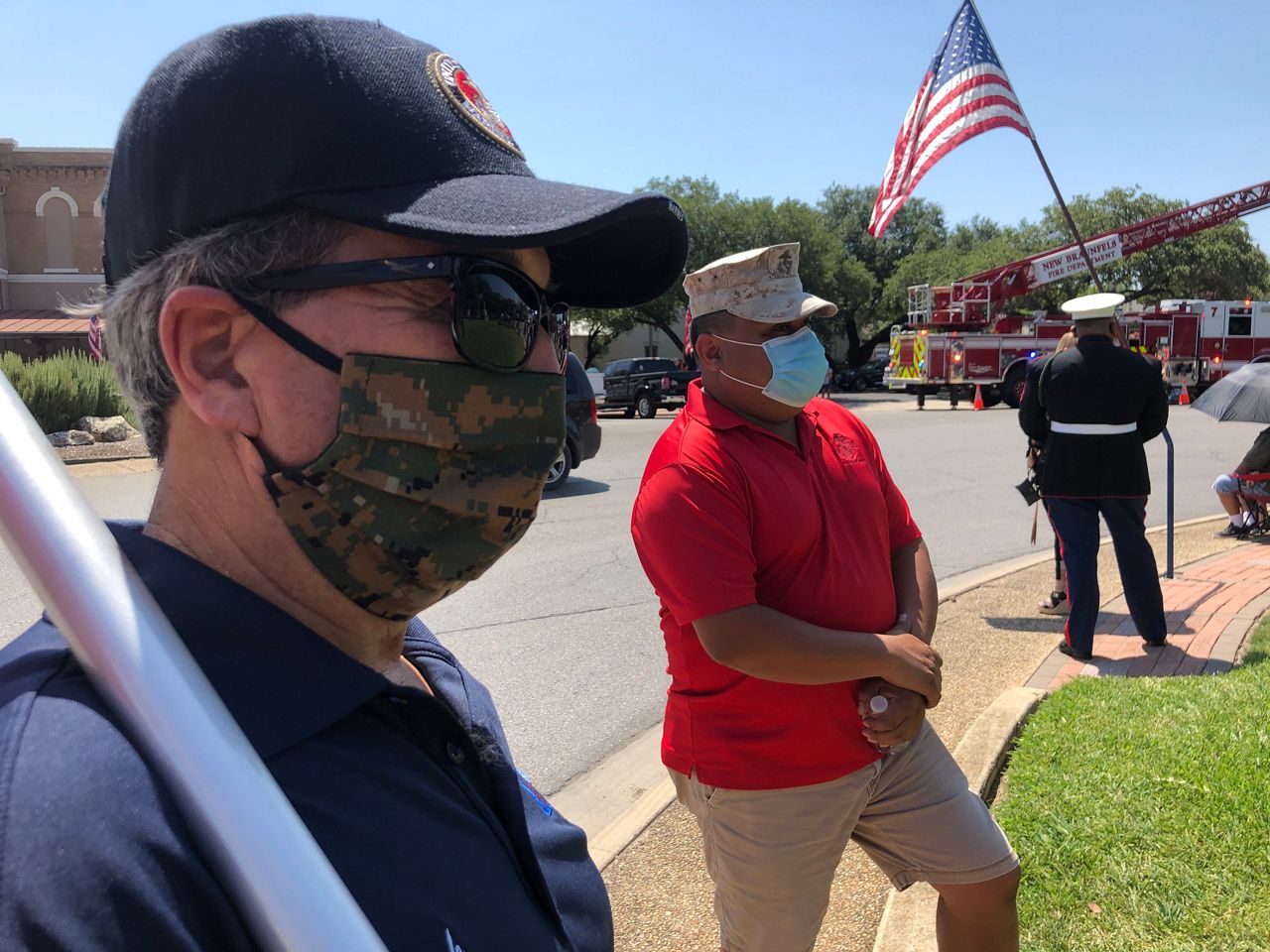 Veterans Luis Almanza and Mark Kauzlarich stand next to each other while a fallen New Braunfels Marine is honored (Spectrum News)