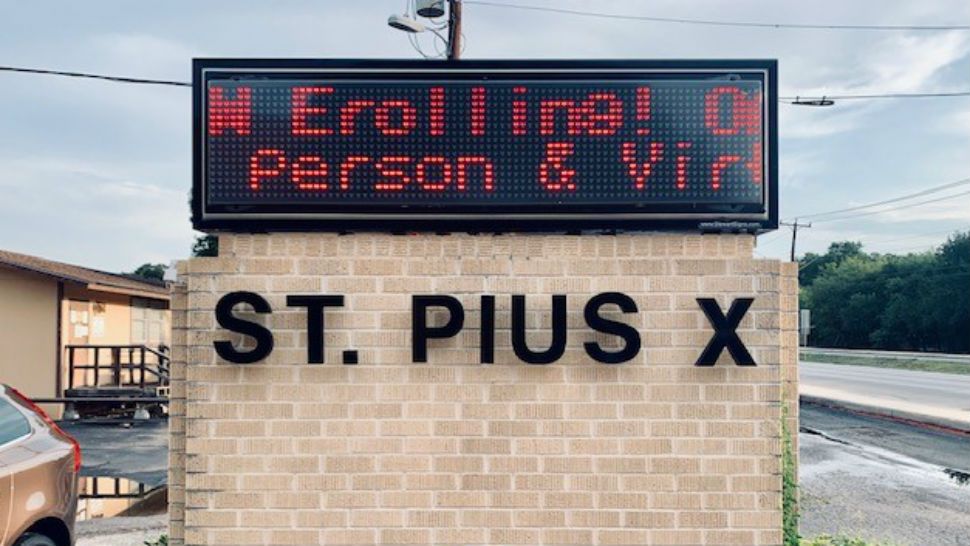 Sign in front of St. Pius X Catholic school. (Sarah Duran/Spectrum News)