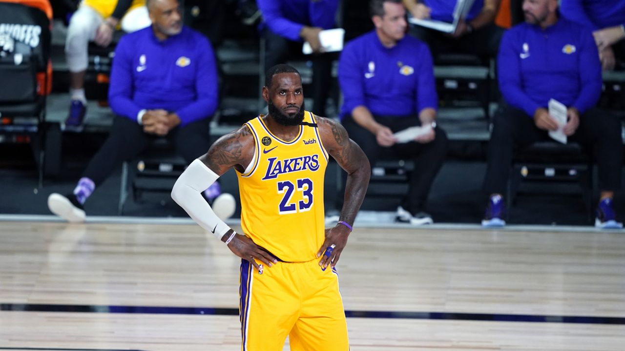 Los Angeles Lakers forward LeBron James (23) walks on the court during the second half of an NBA basketball game against the Portland Trail Blazers Tuesday, Aug. 18, 2020, in Lake Buena Vista, Fla. (Ashley Landis/AP)