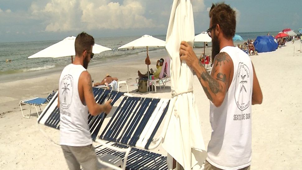 Tyler Wells and Tyler Morris operate Saltwater Destination on Madeira Beach. Both are worried about the affect red tide could have on businesses. (Kate Jones, staff)