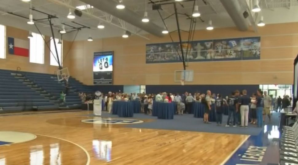 People gather inside the new gym at Central Catholic High School August 17, 2019 (Spectrum News)