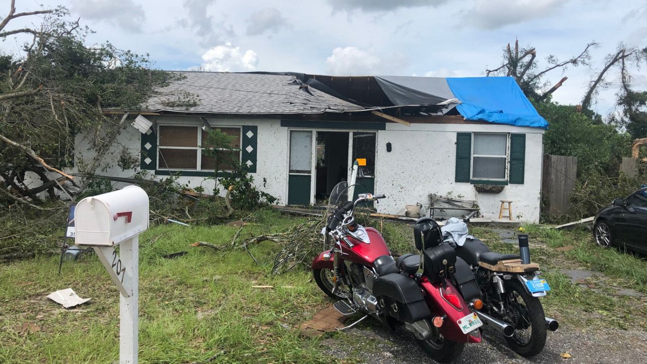 A home that lost part of its roof in the DeLand area after a tornado came through Tuesday. (Ben Boocker, Spectrum News)