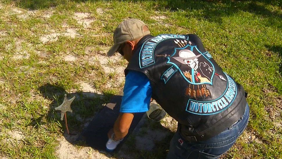 Members of the Veteran Enforcers Motorcycle Association are working to restore the headstones of veterans at the Hollywood Cemetery. (Deborah Souverain, staff)