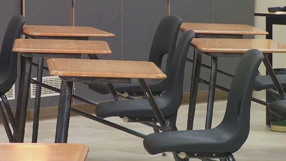 (File photo of empty classroom chairs)