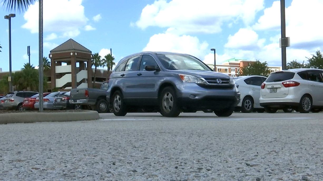 The new security system means that students, faculty, and staff are being required to park nose-in, plate-out on campus; drivers who don't could get ticketed. (Spectrum News 13)