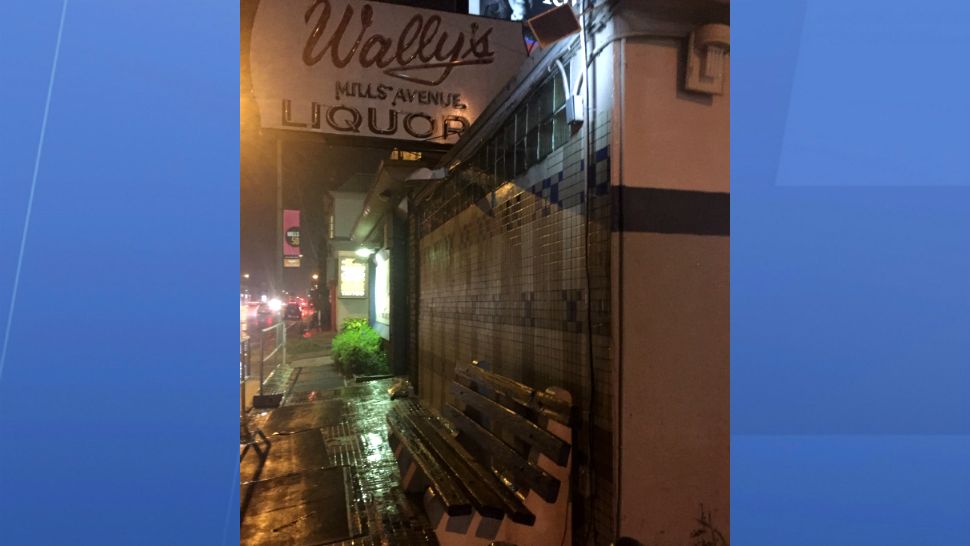 A vigil to celebrate Wally's Mills Avenue Liquors was held Tuesday night. (Christie Zizo, staff)