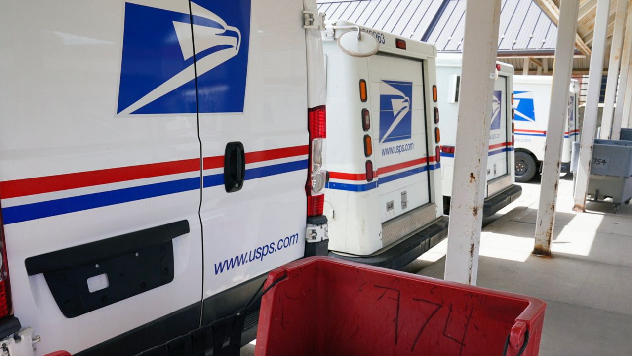 U.S. Postal Service trucks (AP Photo/File)