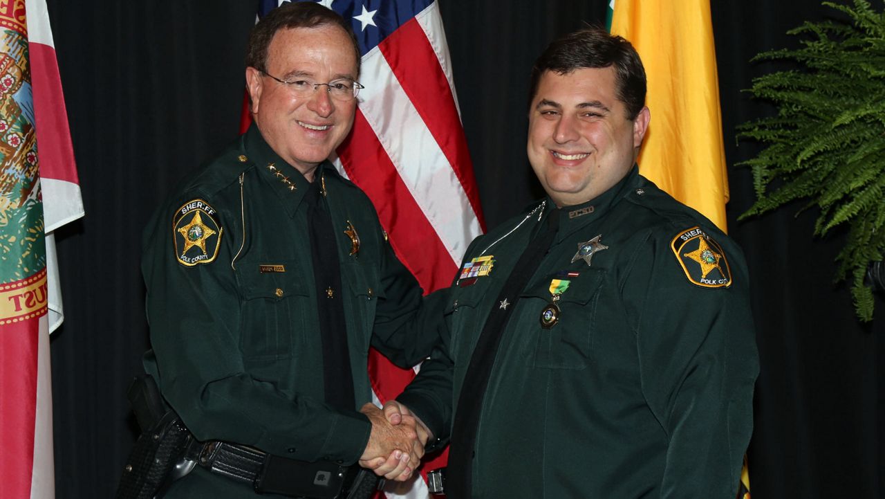 Deputy Sheriff Christopher Broadhead is pictured here with Sheriff Grady Judd in 2017. (Polk County Sheriff's Office)