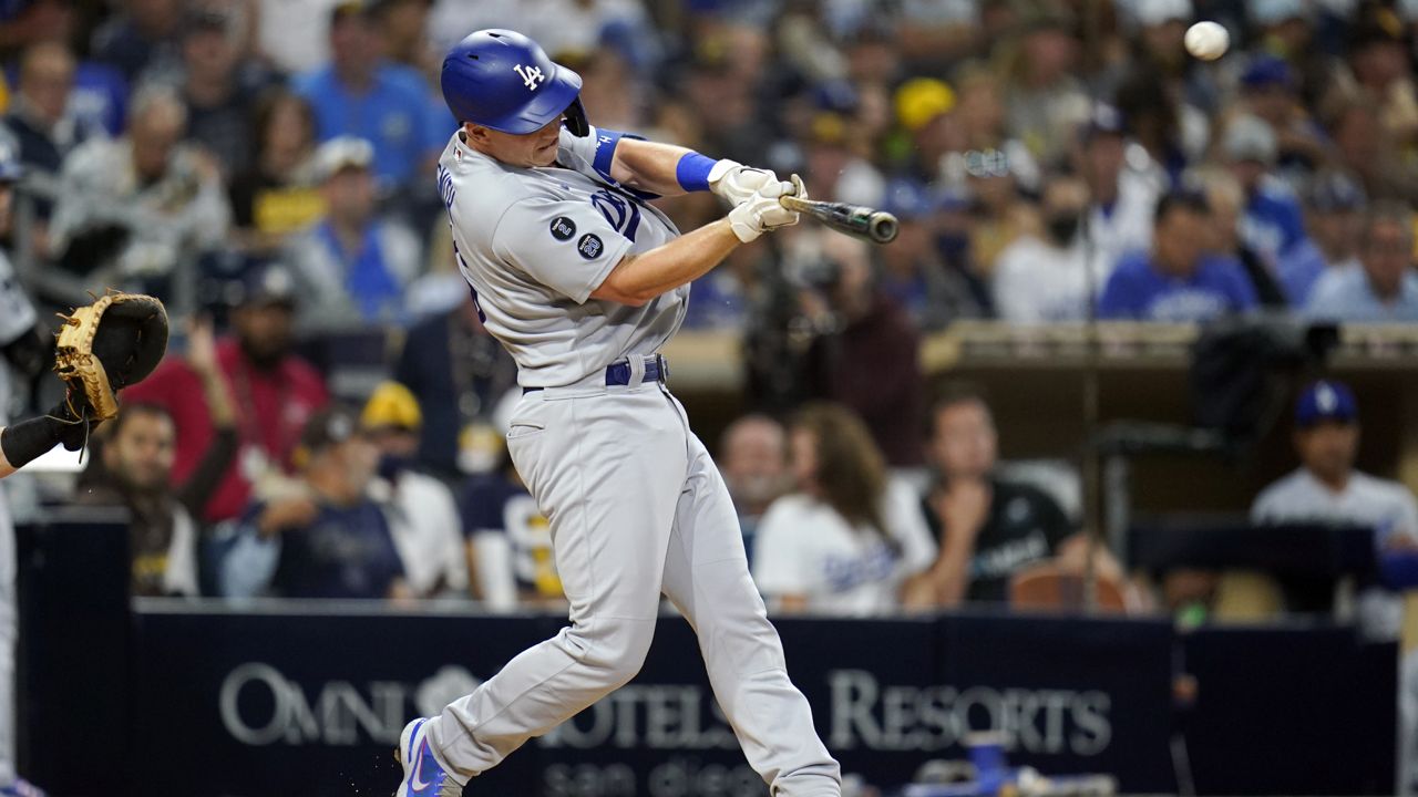 Dodgers outlast rain, defeat Nationals 7-3 to extend NL West lead