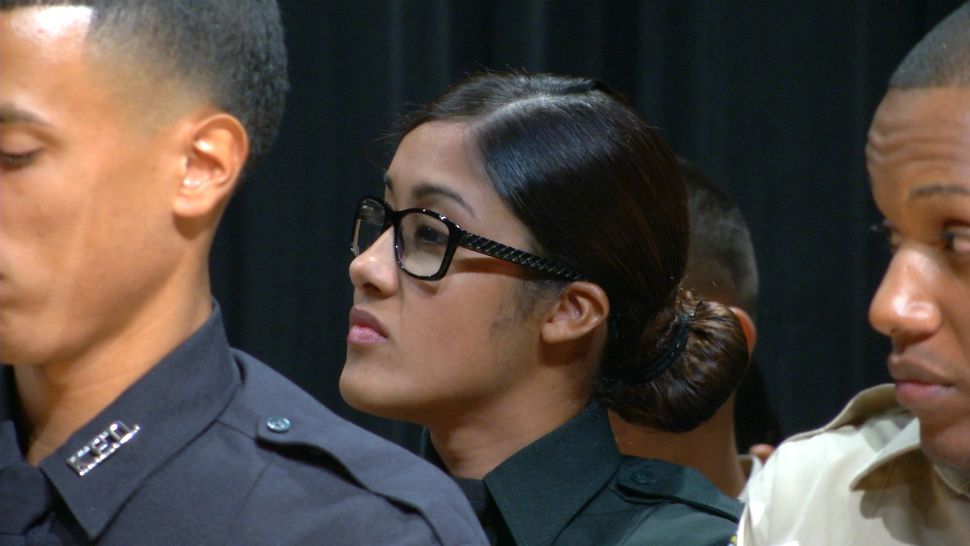 Zuheidy Nieves-Fred attends her pinning ceremony Thursday night at the Osceola County Sheriff's Office. Her father was a law enforcement officer in Puerto Rico for almost 30 years, and she dreamed of following in her dad's footsteps.