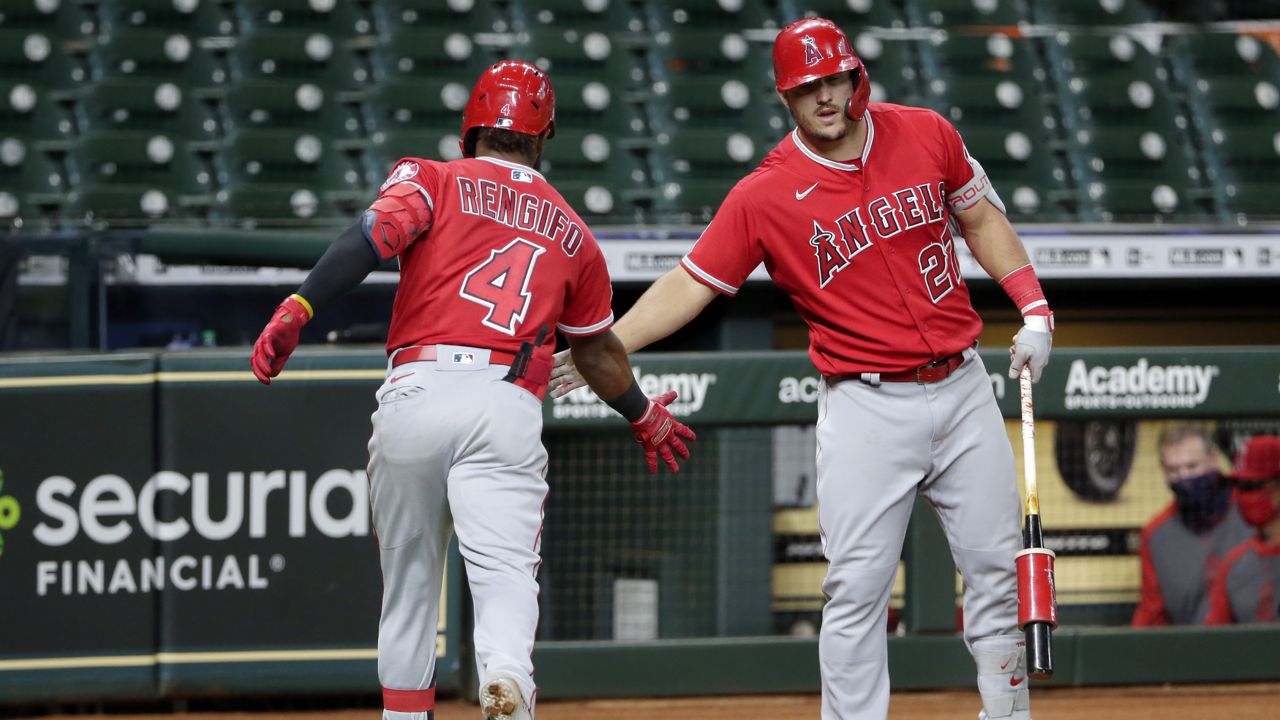 Los Angeles Angels' Luis Rengifo (4) gets congrats from Mike Trout (27) after Tengifo's home run during the fourth inning of the second game of a baseball doubleheader against the Houston Astros Tuesday, Aug. 25, 2020, in Houston. (AP Photo/Michael Wyke)