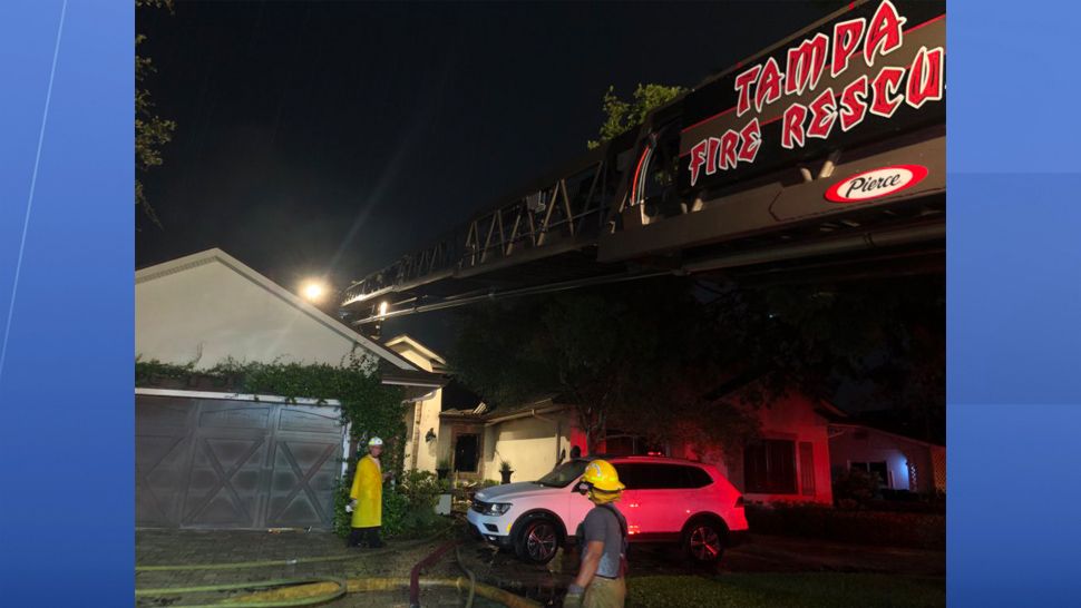 Tampa Fire Rescue responded to the home at 5117 W San Jose Street around 7:30 p.m. where they found heavy smoke and flames shooting through the roof of the single-story home. (Tampa Fire Rescue)