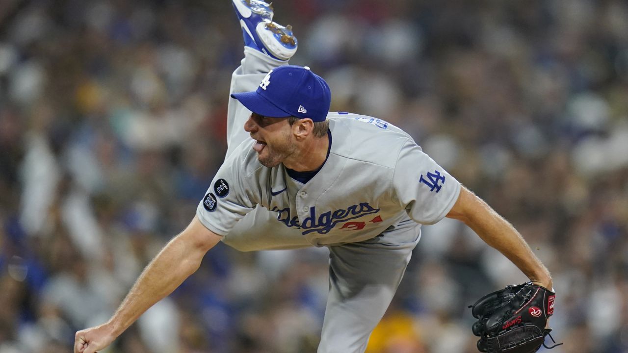 Los Angeles Dodgers starting pitcher Max Scherzer works against a San Diego Padres batter during the fourth inning of a baseball game Thursday, Aug. 26, 2021, in San Diego. (AP Photo/Gregory Bull)