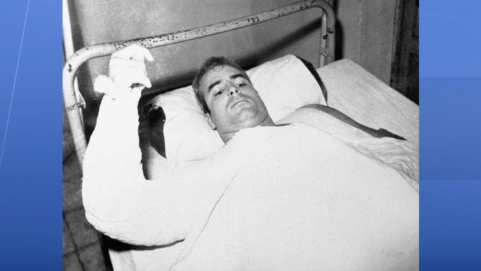 FILE - In this undated file photo provided by CBS, U.S. Navy Lt. Commander John S. McCain lies injured in North Vietnam. McCain, the war hero who became the GOP’s standard-bearer in the 2008 election, died Saturday, Aug. 25, 2018. He was 81. (CBS via AP, File)