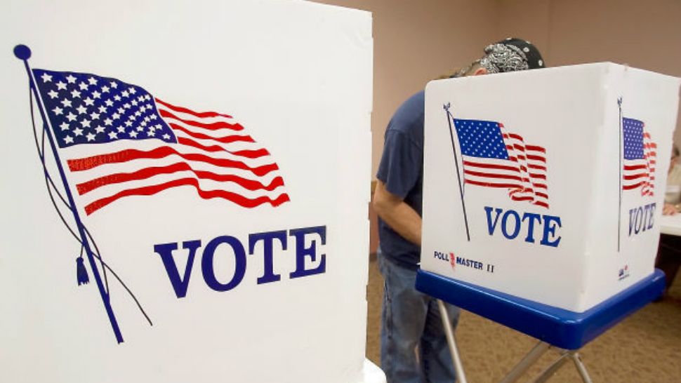 A man in a voting booth. (Spectrum News/File)