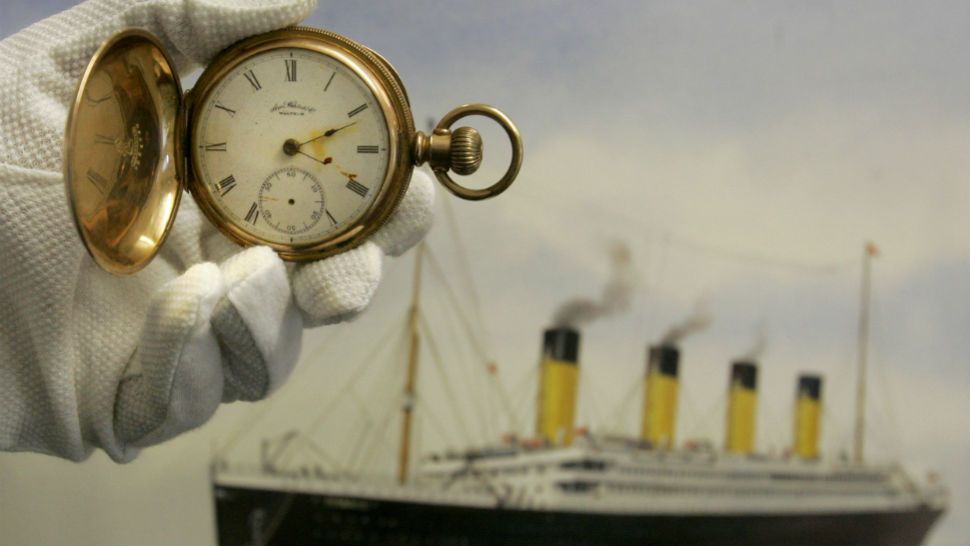 A gold plated Waltham American pocket watch, the property of Carl Asplund, is seen in front of a modern water colour painting of the Titanic by CJ Ashford at Henry Aldridge and Son auctioneers in Devizes, Wiltshire, England Thursday, April 3, 2008. The watch, expected to reach 15,000- 20,000 pounds, euro19, 000-25,000, US$30,000- 39,000 was recovered from the body of Carl Asplund who drowned on the Titanic and is part of the Lillian Asplund collection, the last American survivor of the disaster, which go on auction on April 19. Asplund was 5 in April 1912, when the Titanic hit an iceberg and sank on its maiden voyage from England to New York. Her father and three siblings were among 1,500 people who died. (AP Photo/Kirsty Wigglesworth)