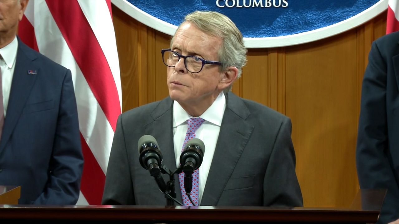 Governor Mike DeWine speaks from a podium