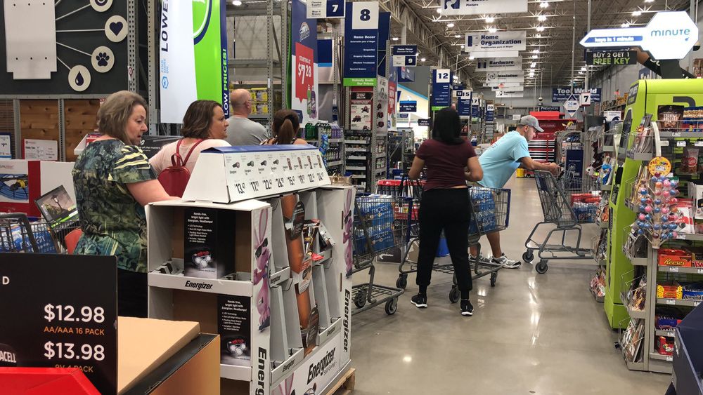 Shoppers pick up hurricane supplies at an area Lowe's on Friday, August 30. (Rebecca Turco, Staff)