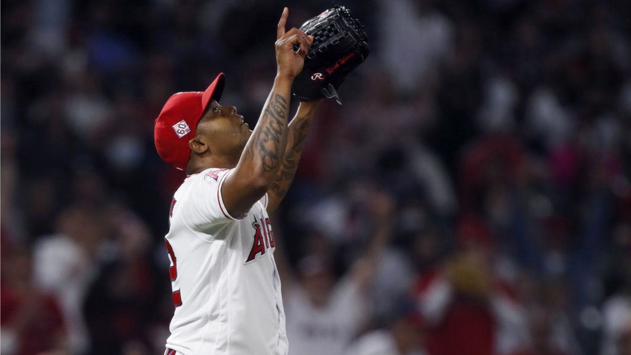 Los Angeles Angels relief pitcher Raisel Iglesias reacts on the mound after New York Yankees' DJ LeMahieu grounded out to third during the ninth inning of a baseball game in Anaheim, Calif., Tuesday, Aug. 31, 2021. (AP Photo/Alex Gallardo)