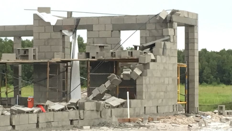 A wind gust blew over a wall at this Wesley Chapel construction site, injuring two workers when the wall fell on them. (Laurie Davison, staff)
