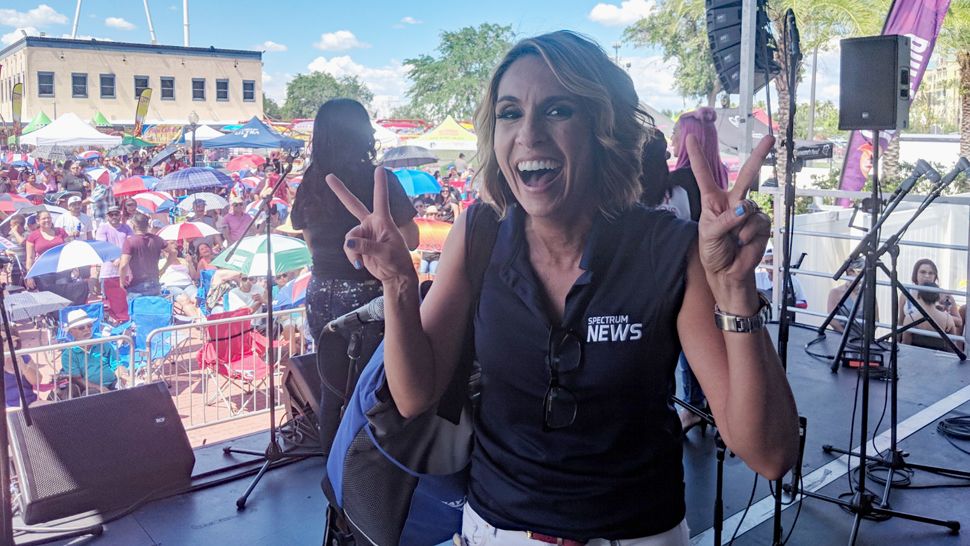 Spectrum News 13 anchor Ybeth Bruzual and Hispanic Beat reporter Jesse Canales greeted attendees at Latin Fiesta Nights at Old Town and helped them cool down with Spectrum News 13 water bottles. 