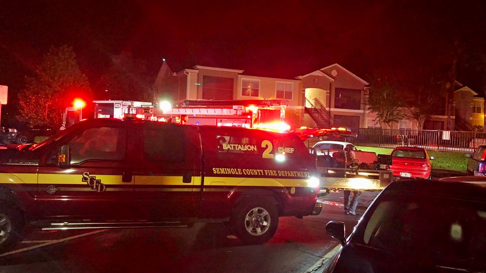 Seminole County firefighters rescued a man in a burning apartment unit at the Fountain Place Properties in Casselberry early Tuesday morning. (Jesse Canales/Spectrum News 13) 