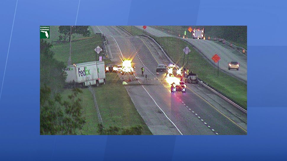 A FedEx semi tractor-trailer driving at normal speed on the Florida Turnpike struck two vehicles driving at around 5 miles per hour Tuesday, resulting in a fatal crash that closed the roadway for hours, according to the Florida Highway Patrol. 