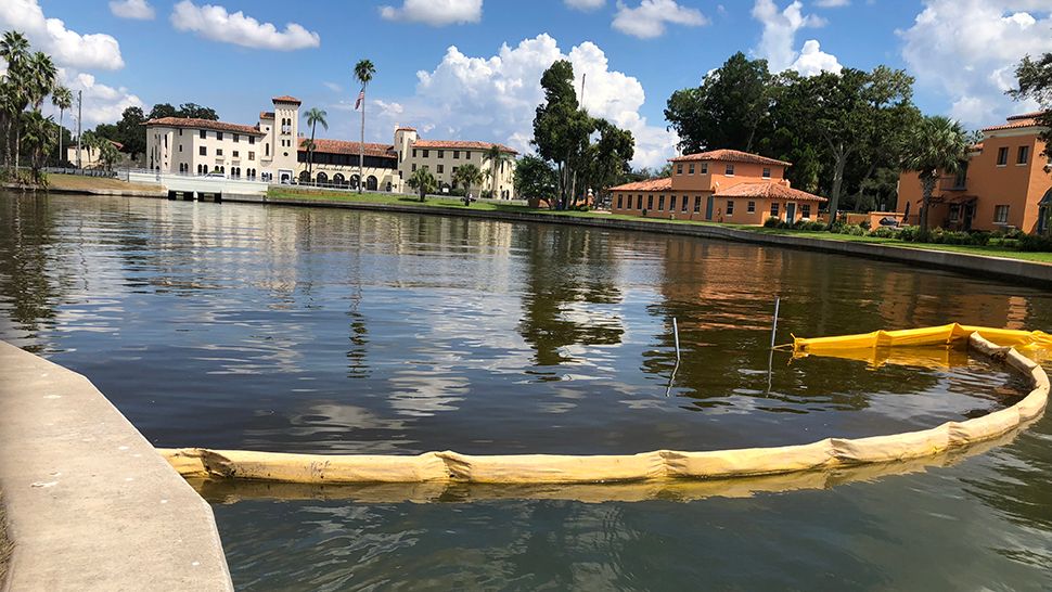The silt wall was installed in the mouth of the basin and so far, school officials say it is working and preventing dead fish from floating in. (Trevor Pettiford, staff)
