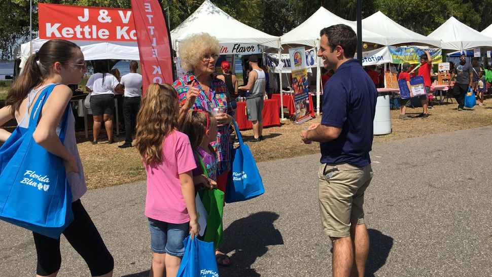 Spectrum News 13 joined 23,000 attendees at the Pig on the Pond festival in Clermont benefiting Project Scholars in March of 2019. Meteorologist Chris Gilson and other staff greeted families and festival goers and handed out Spectrum News 13 car phone chargers and Project Weather Activity Books. 