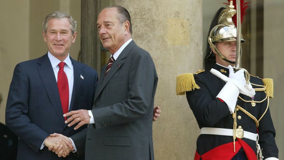 In this June 5, 2004 file photo, President Bush meets with French President Jacques Chirac as a French honor guard member stands guard at the Elysee Palace in Paris. Jacques Chirac, a debonair master of politics who championed French grandeur and whose 12 years as president were overshadowed by tensions with the United States over his opposition to war in Iraq. (AP Photo/Charles Dharapak, File)