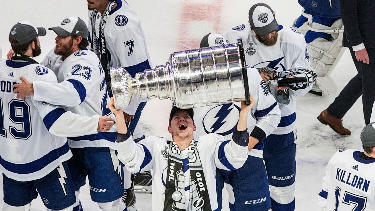Tampa Bay Lightning's Ondrej Palat (18) hoists the Stanley Cup after defeating the Dallas Stars in the NHL Stanley Cup hockey finals, in Edmonton, Alberta, on Monday, Sept. 28, 2020. (Jason Franson/The Canadian Press via AP)